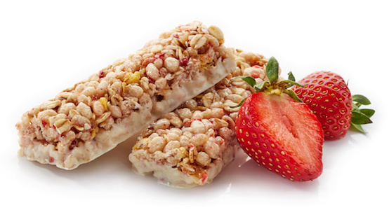 Delicious and healthy granola bars with freshly cut strawberries